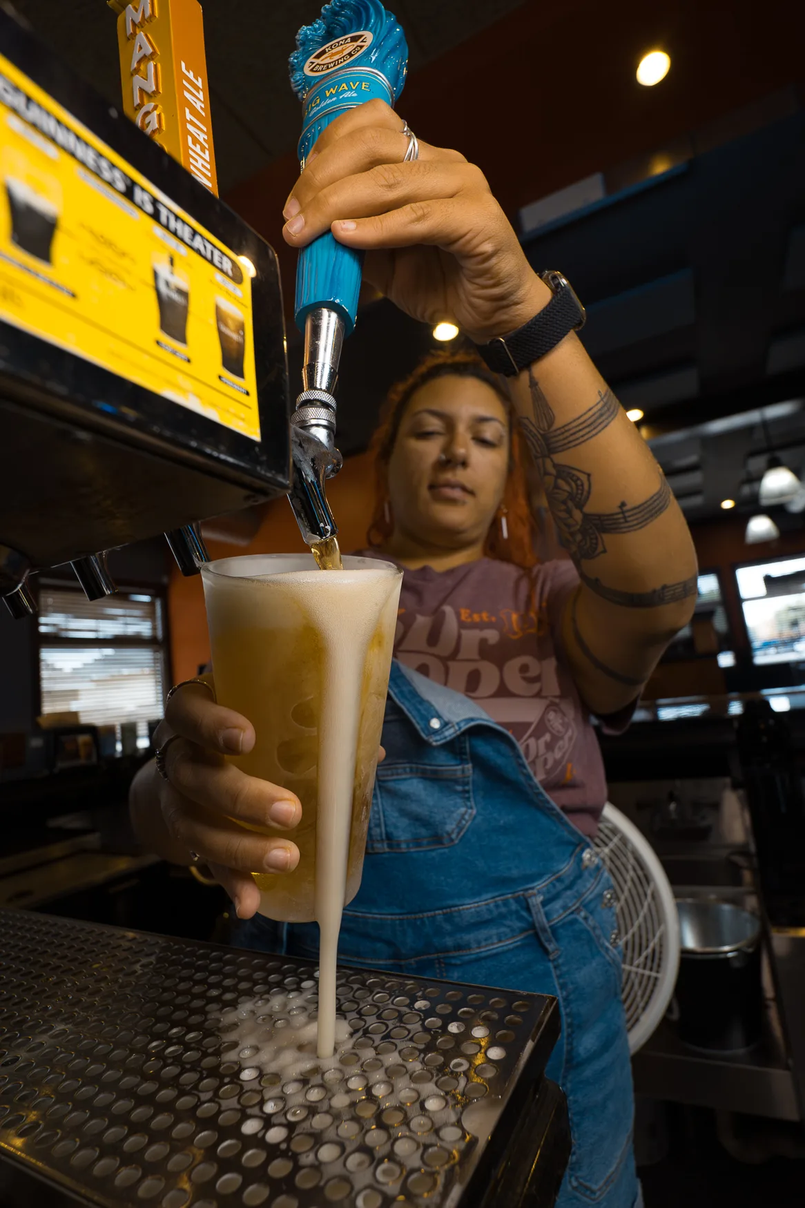 Pouring a cold draft beer behind the bar at 212 The Boiling Point Pouring a cold draft beer behind the bar at 212 The Boiling Point