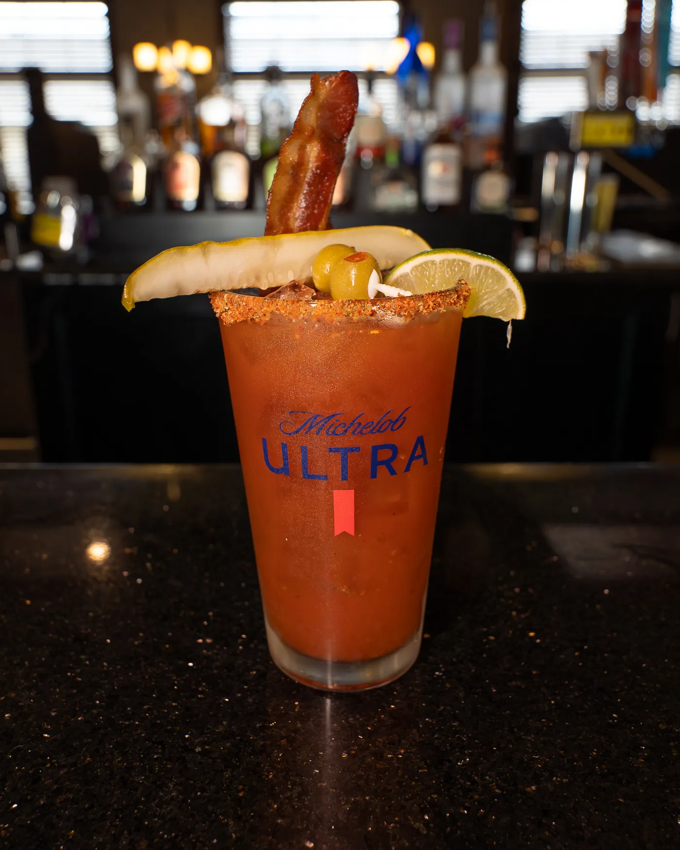 A loaded bloody mary topped with bacon and a lemon wedge at 212 A loaded bloody mary topped with bacon and a lemon wedge at 212